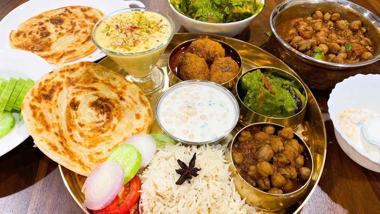 Bhaj Govindam Special Thaali (Dal of the day , Paneer of the day , Dry veg of the day ,Raita of the day , Veg Pulao 1pcs mini lacha + 1 pcs mini naan Pickle, Salad, Papad, Sweet)
